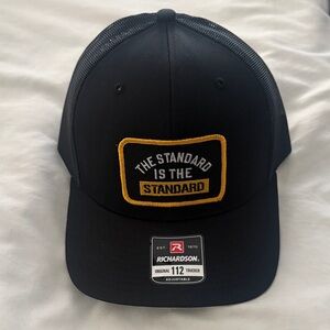 Coach T Black Trucker Hat - "The Standard is the Standard"